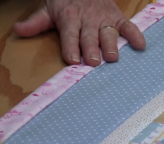 sew bind of baby quilt