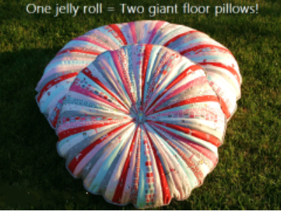 two oversized floor pillows in pink and red