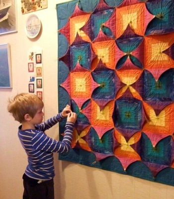 Quilt Pattern With Buttoned Flaps wall quilt on display