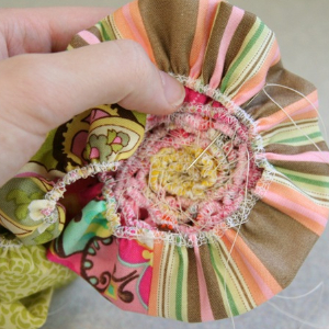 how to make a scrappy rose brooch from fabric strips