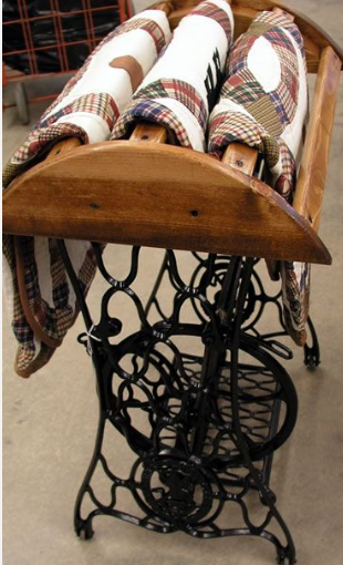 quilt rack made from an antique sewing machine