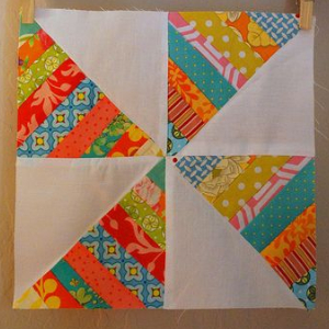 make a pinwheel block with half square triangles