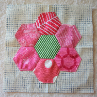 appliqued hexagon flower on mini charm square