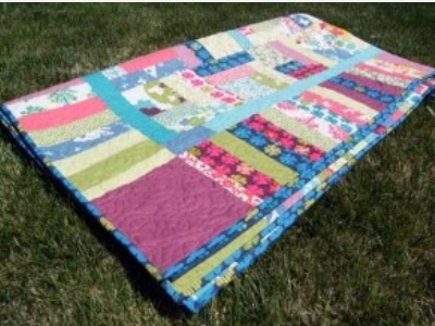 pretty-squaredy-cat-jelly-roll-quilt-with-colorful-binding