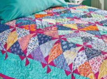 aqua-marine-quilt-with-pink-pinwheels