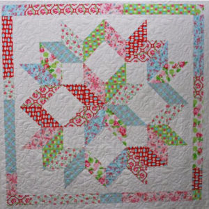 christmas-carpenter-wheel-quilt