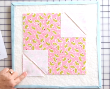 cut-the-corner-diagonally-to-make-an-xoxo-quilt-block