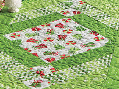 jelly-roll-holiday-table-runner-showcase-gifts-print-fabric-in-the-center