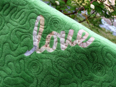 the-word-love-written-on-the-back-of-a-quilt