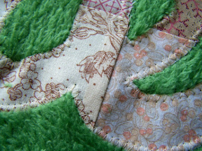 zigzag-edges-to-secure-words-to-the-back-of-the-quilt