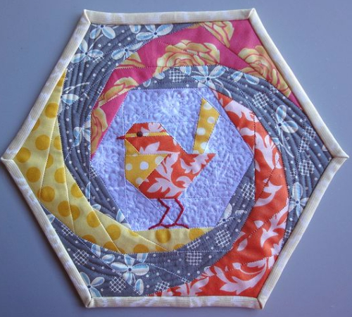 hexagon hot pad with a cute robin