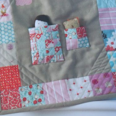 miniature quilts on a doll quilt from Pretty In patchwork