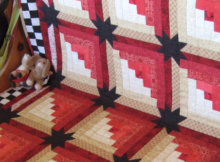 Eleanor Burns Log Cabin quilt with stars in the sashing