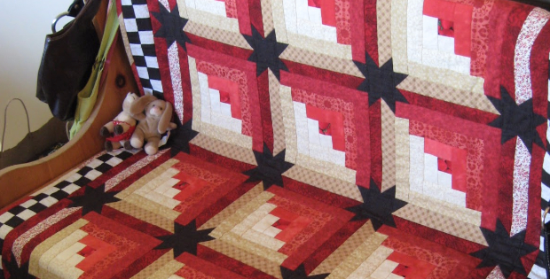 Eleanor Burns Log Cabin quilt with stars in the sashing