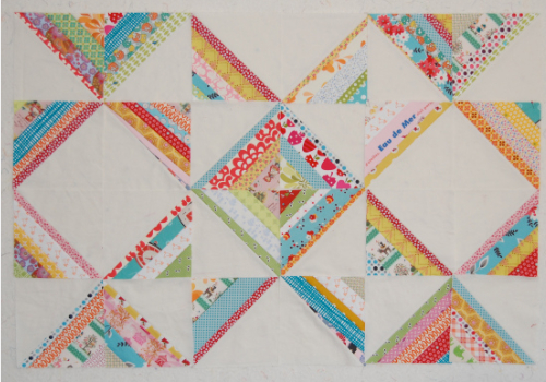 string quilt blocks with floral prints