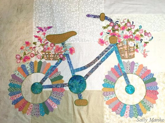 Bicycle quilt with basket of flowers