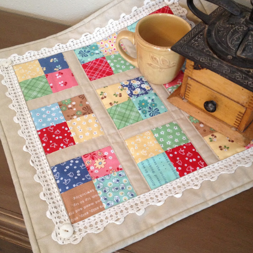 four patch table topper with crochet
