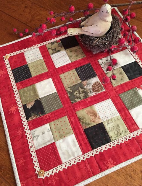 quilted table topper with crochet trim