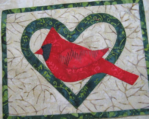 Cardinal mug rug in heart