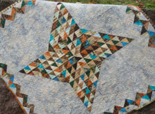 star baby quilt with faceted quilt block