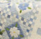 Blue Delft quilt with white blossoms