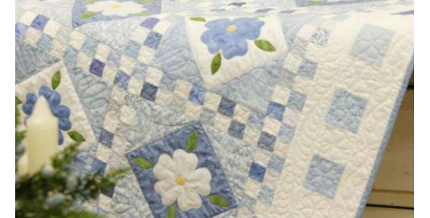 Blue Delft quilt with white blossoms