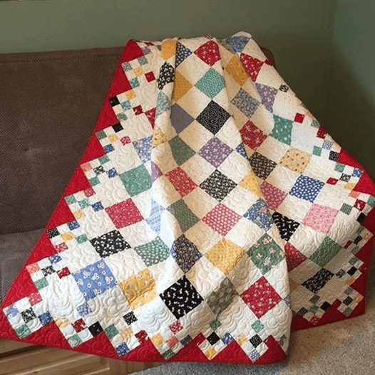 Diamond patch baby quilt
