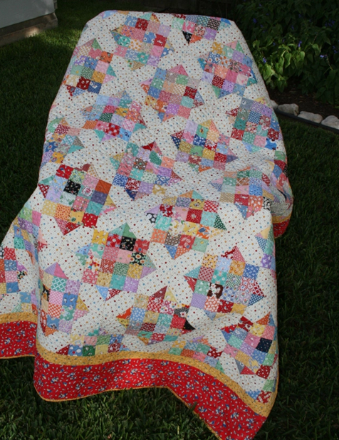 jelly roll quilt four patch with x and o
