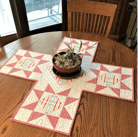 Holiday fabricTable runner with star blocks free quilt pattern