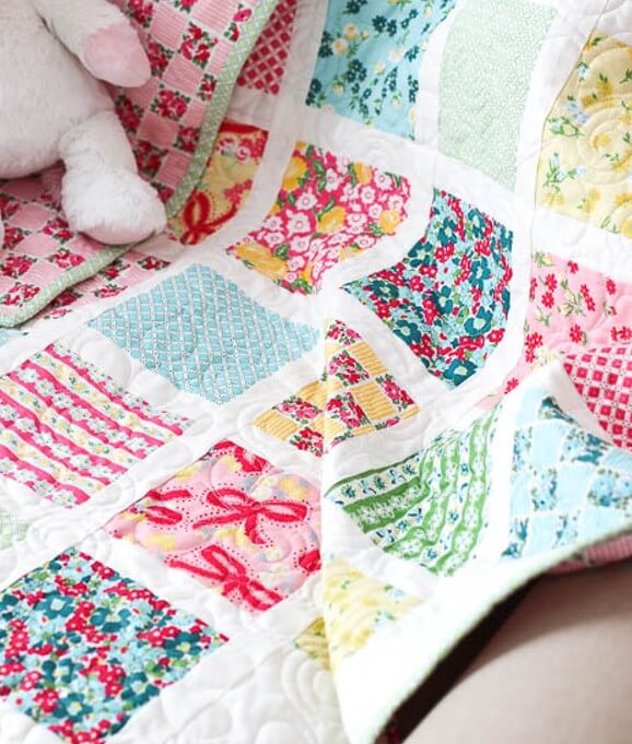 Cut charm squares with Creative Grids Perfect 5 five inch ruler