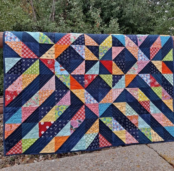 Sunshine On A Cloudy day quilt pattern with half square triangles