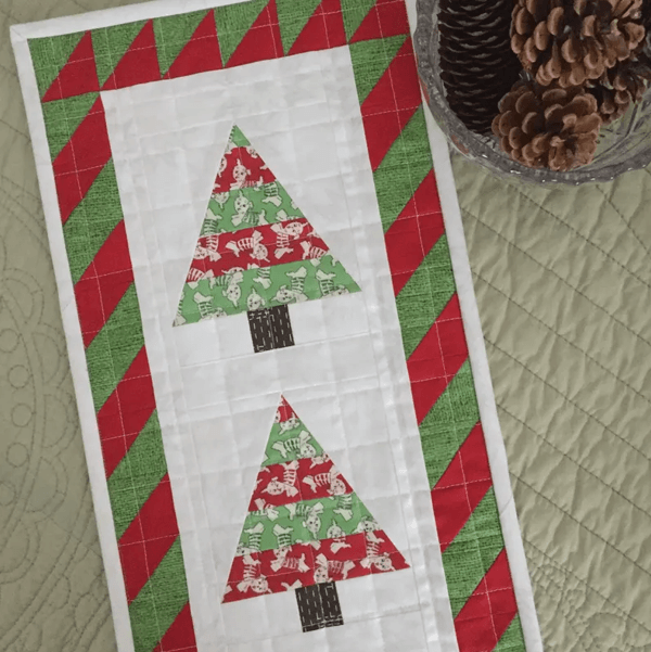 Christmas tree mini quilt with puppy dogs fabric